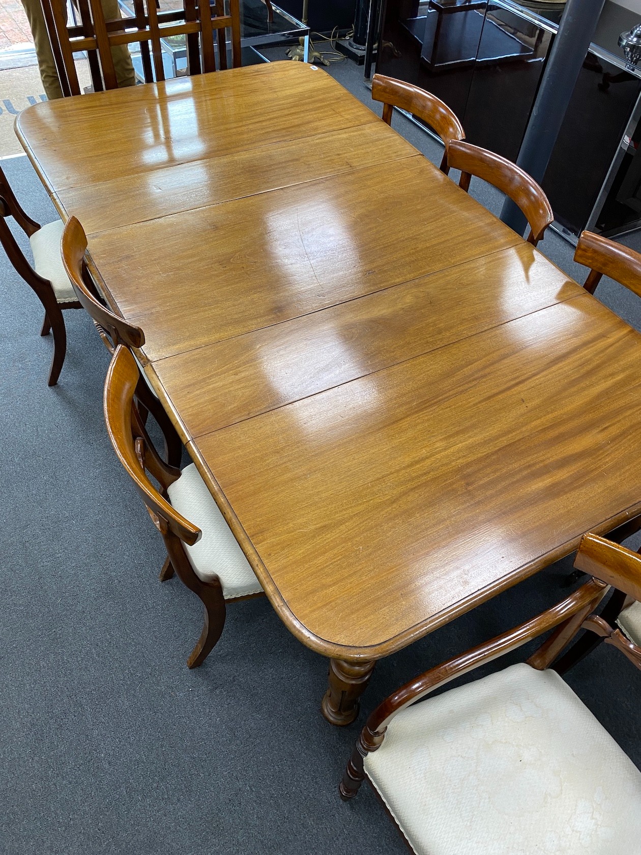 An early Victorian mahogany rectangular extending dining table, length 220cm extended, three spare leaves, width 120cm, height 73cm